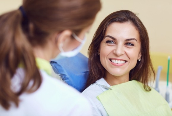 Woman discussing oral cancer diagnosis with dentist