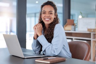 Woman smiling while working in office