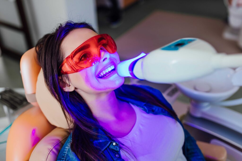 Woman having her teeth whitened